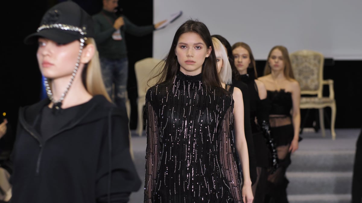 Young models walking a luxury illuminated runway